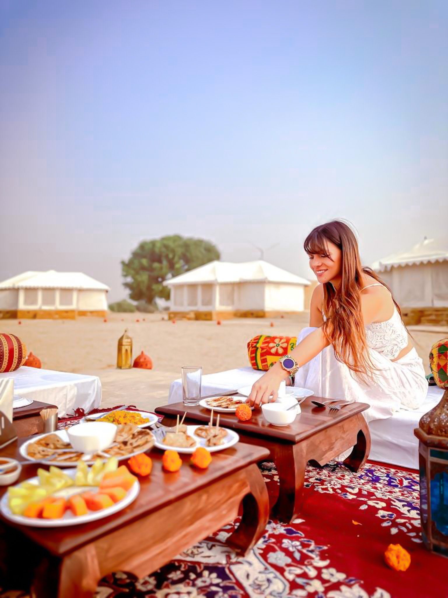 Girl drinking coffe at a terraza with a castle behing